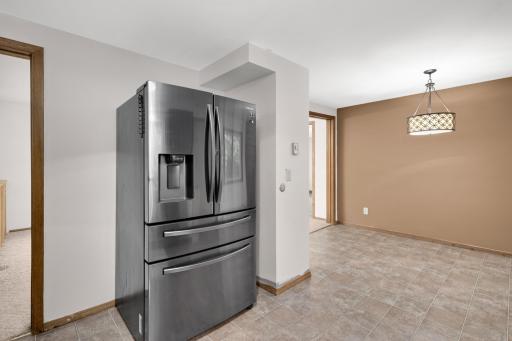 New black stainless steel fridge stands out against the fresh paint!