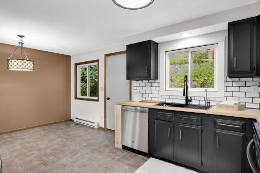 Great kitchen window and informal dining access to one of the back yard decks and a patio.