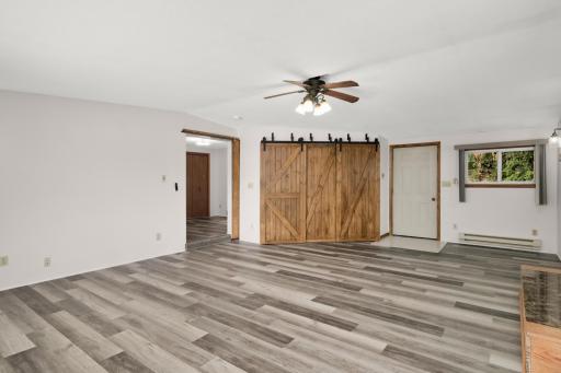 The deck through this door boasts an amazing brick fireplace