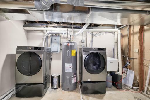 New high end washer and dryer in the lower level with pedestal storage drawers. Convenient utility sink.
