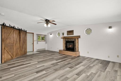 Large corner closet for storage behind the barn door could become a bar area. Private entrance from the second deck.