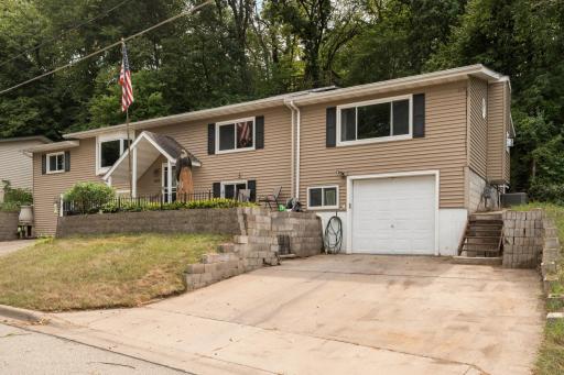 Recent family room and garage addition with a heated garage stall that is great for a workshop or mechanics work space if not needed for a car. Additional parking area as well.