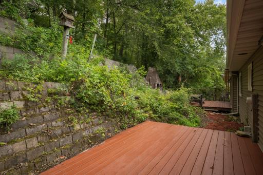 This freshly stained deck is off of the dining area and adjacent to a shaded patio