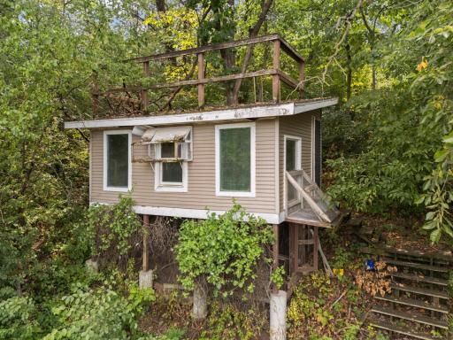 Former pigeon coop could be a garden shed, art studio, play house or pigeon coop! How would you utilize this outbuilding?