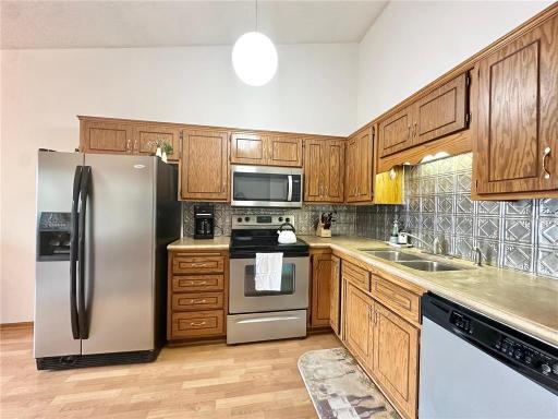 Enjoy the spacious kitchen with durable vinly flooring, SS appliances, and ample room for cooking and entertaining