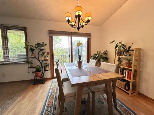 Bright dining area with abundant natural light and direct access to the deck.