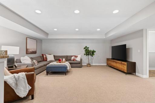 Walk-out Lower Level w/ Family Room, entertainment bar, gaming space + wet bar