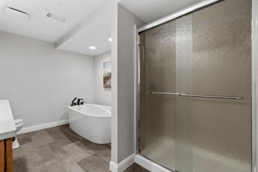 LL bath beautifully updated w/ free-standing tub & quartz counters
