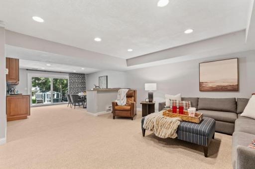 Walk-out Lower Level w/ Family Room, entertainment bar, gaming space + wet bar