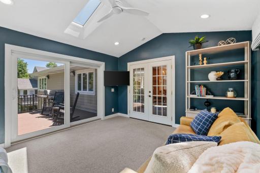 Stunning 4-Season Porch w/ vaulted ceilings, skylight and walkout to maintenance-free deck