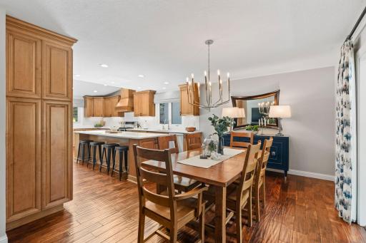 Fully remodeled Gourmet Kitchen w/ custom cabinetry, oversized island, quartz counters, SS apps + beverage fridge