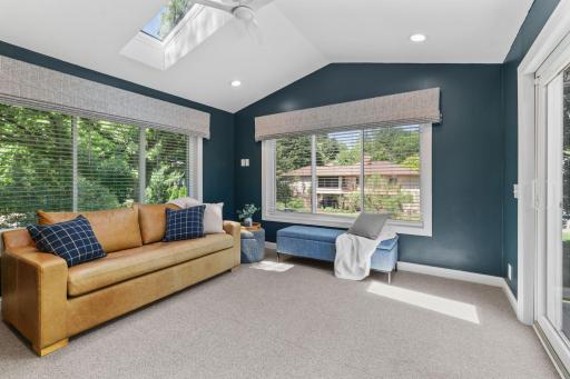 Stunning 4-Season Porch w/ vaulted ceilings, skylight and walkout to maintenance-free deck