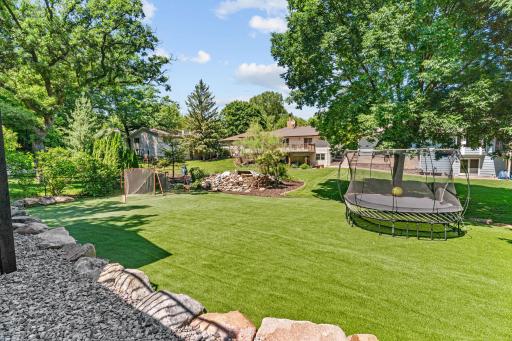 Upgraded maintenance-free turf in backyard