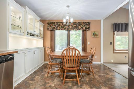 Kitchen view past dining area to large deck just thru sliding door