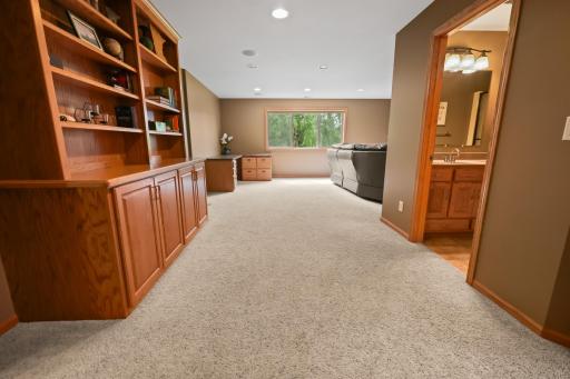 Spacious family room space with built in bookshelves.