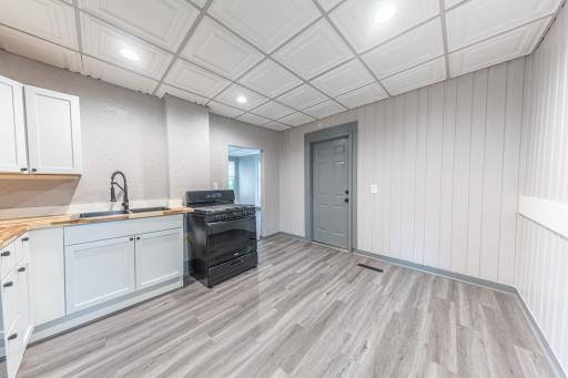 Kitchen has been updated with new cabinets, counters and appliances