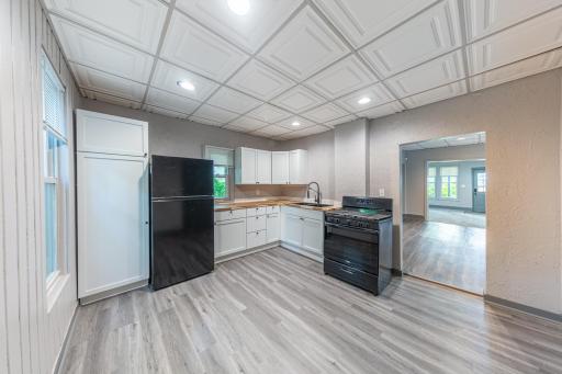 Kitchen has been updated with new cabinets, counters and appliances