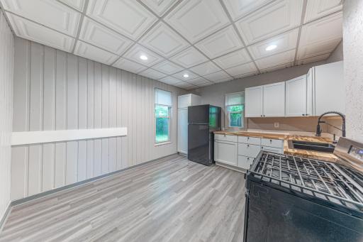 Kitchen has been updated with new cabinets, counters and appliances