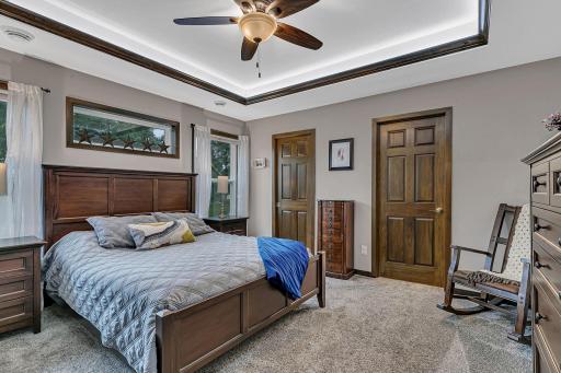 Primary owners suite is spacious with great window placement, trayed ceilings, ceiling fan, and undermount lighting.