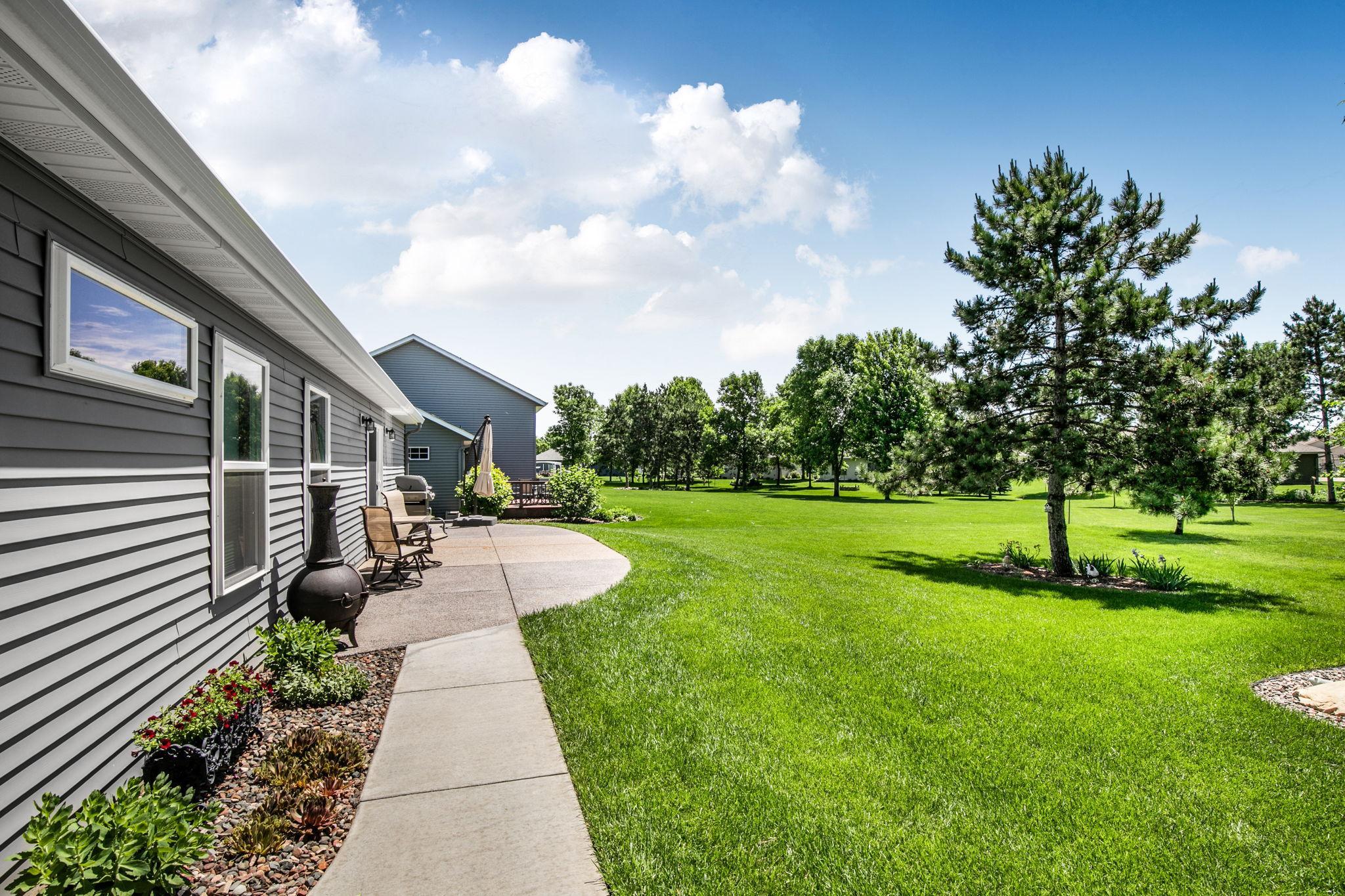 Sidewalk has been extended from the front of the home to the patio.
