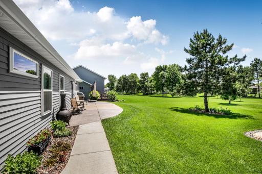Sidewalk has been extended from the front of the home to the patio.
