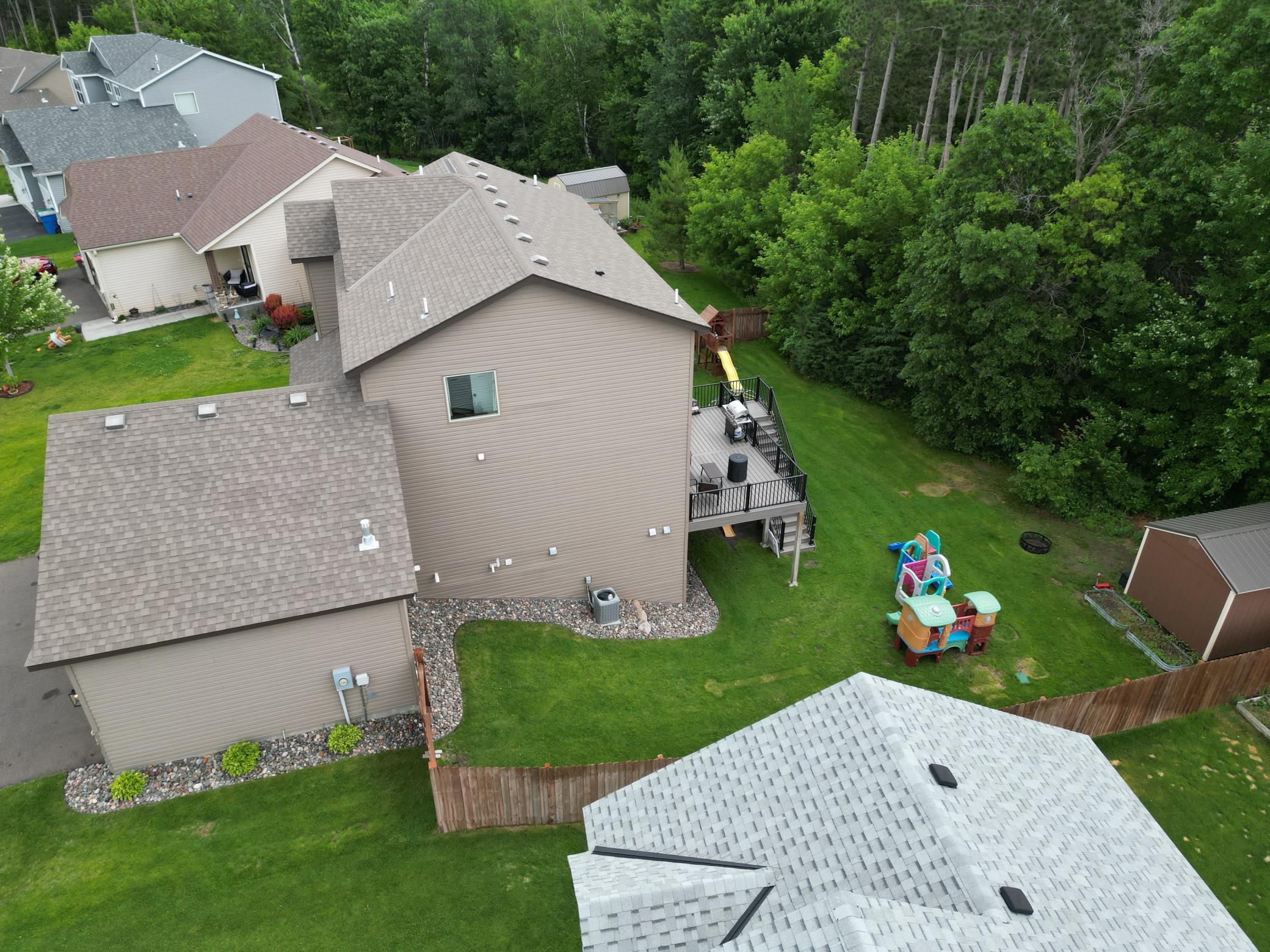 Fenced back yard with a walkout basement and maintenance free deck. Garden Shed and Playset stays. Other play equipment negotiable.