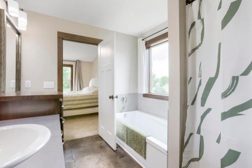 Primary bath with soaking tub and separate shower.