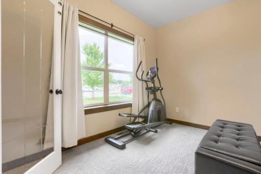 Main floor office or excercise room with see through french doors.