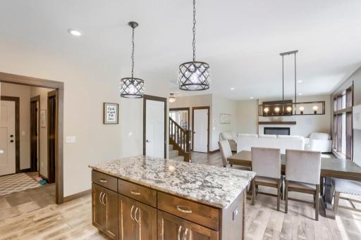 Granite covered center island with open view to the dining and living room.