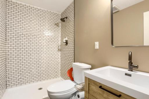 Lower level 3/4 tiled bath. Just add a shower curtain. Near Bedroom #5.