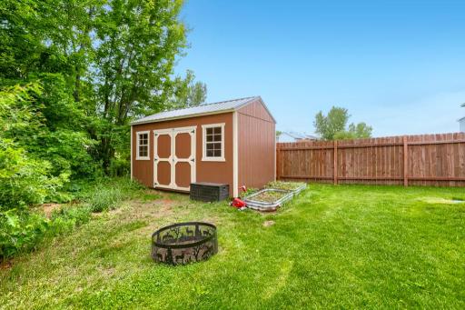 Back yard shed. Bonfire pit and raised gardens.