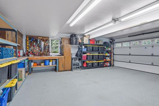 2-car garage with finished floor and storage