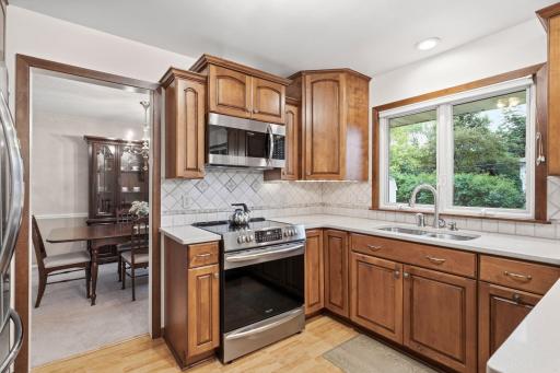 Stainless steel appliances and decorative backsplash add to the modern feel
