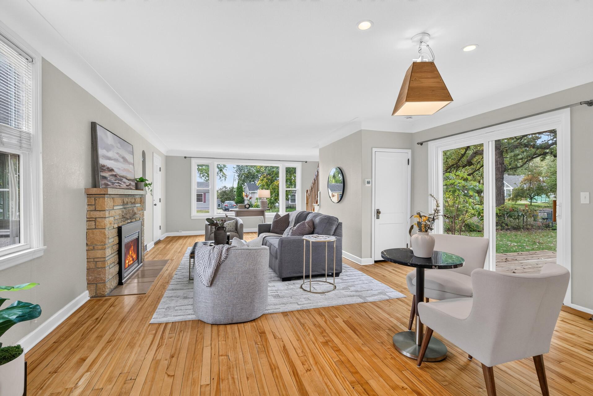 Gleaming original hardwood floors flow throughout the house