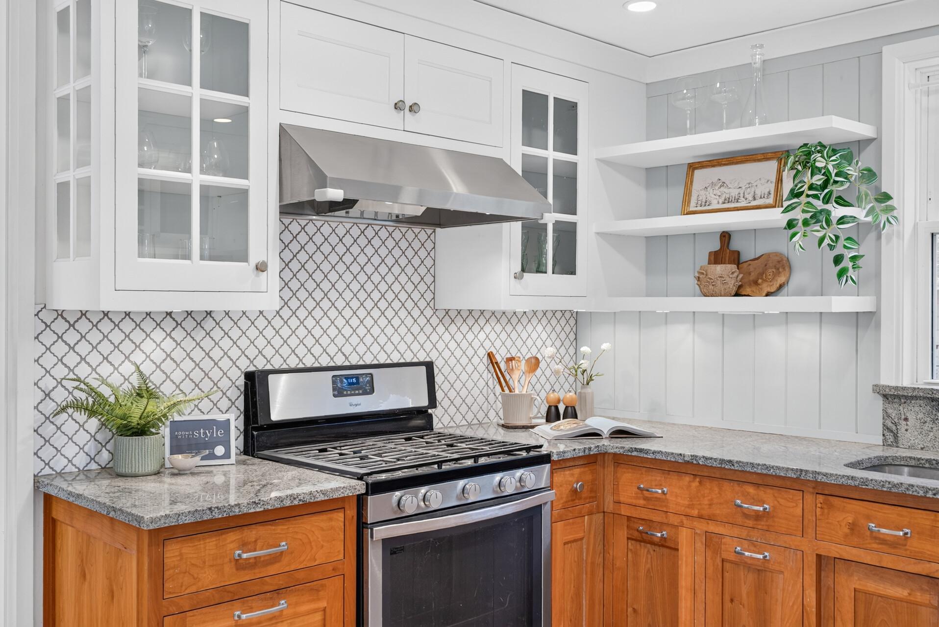 Granite counter tops and effective mix of cabinets and shelving