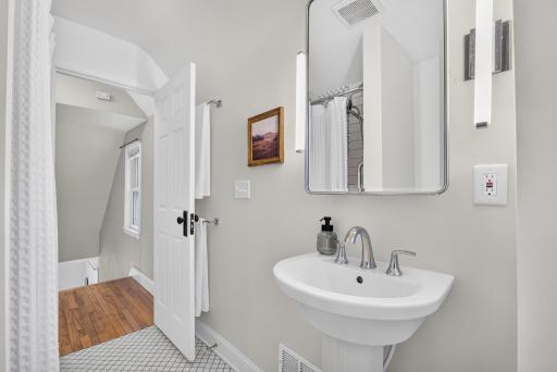 The bathroom is conveniently located at the top of the stairs