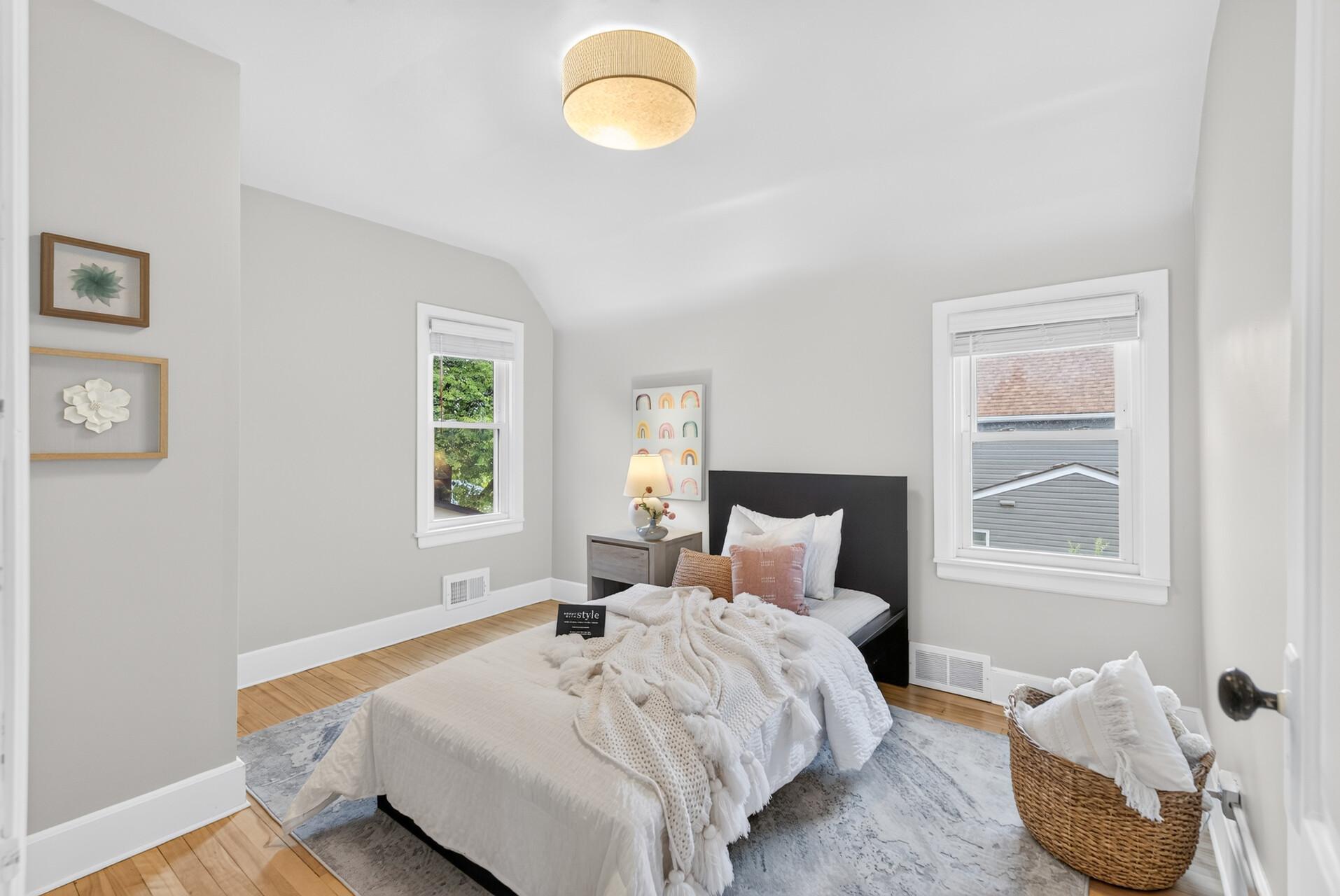 Even the second bedroom feels light and spacious with a high ceiling and two windows