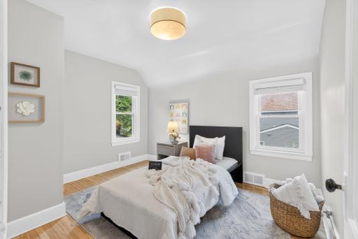 Even the second bedroom feels light and spacious with a high ceiling and two windows