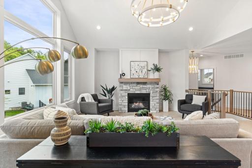 A cozy gas fireplace anchors the room, creating a warm and elegant atmosphere for relaxing or hosting guests.