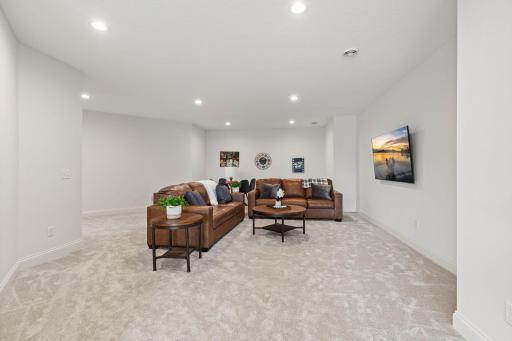 The lower level expands your living and entertaining space with a sun-filled family room and additional recreation area, ideal for a game space, home gym, or media setup.