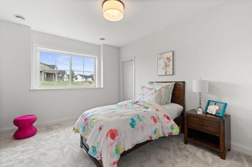 This generously sized bedroom in the lower level provides a comfortable and private retreat.
