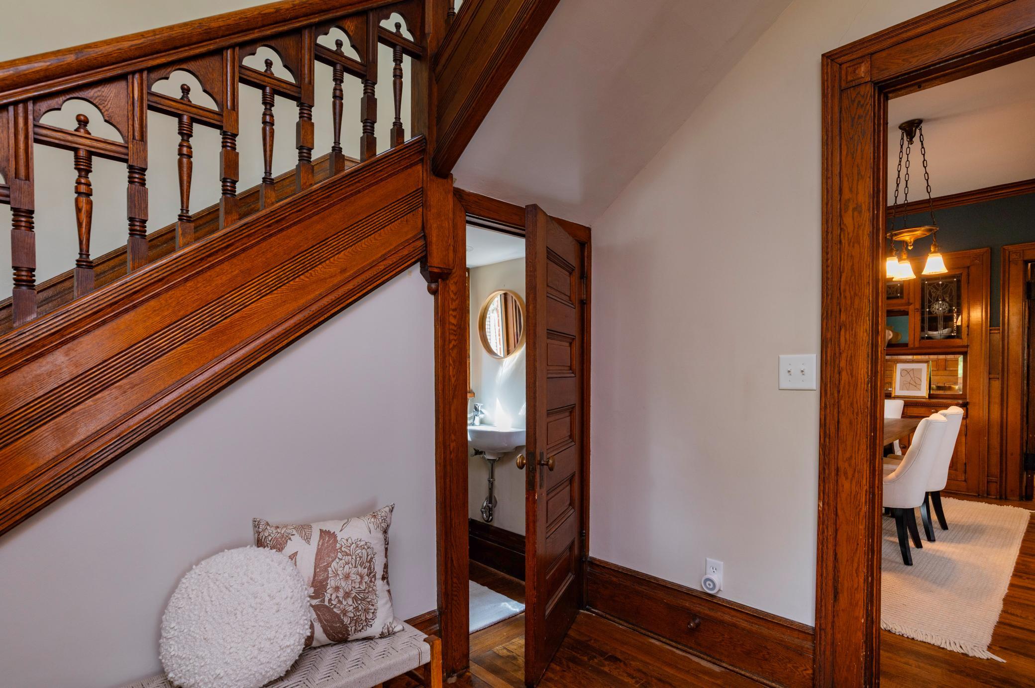 Fun half bath tucked under the front stairs.