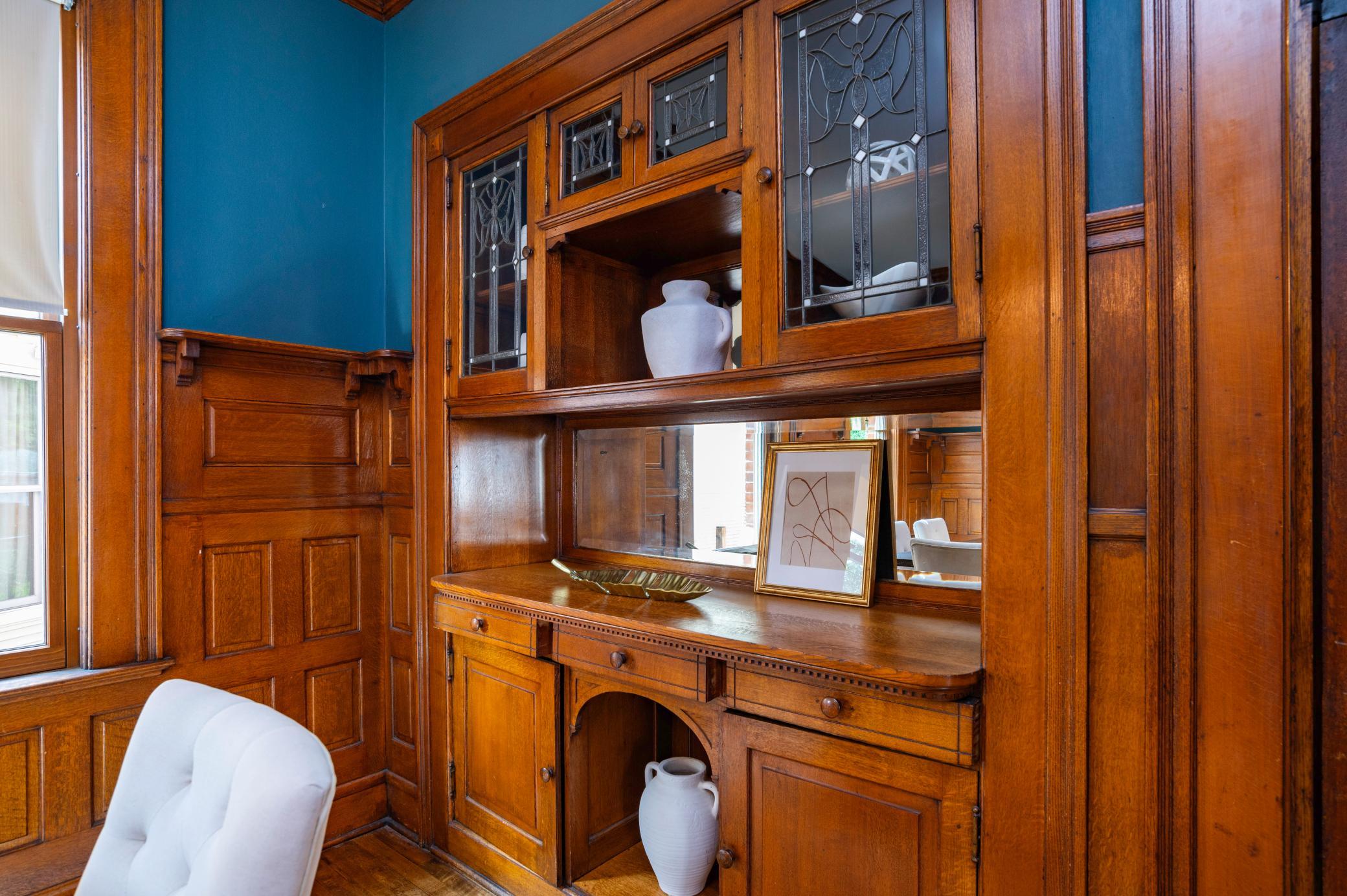 The original built-in buffet still has the original leaded glass door fronts.