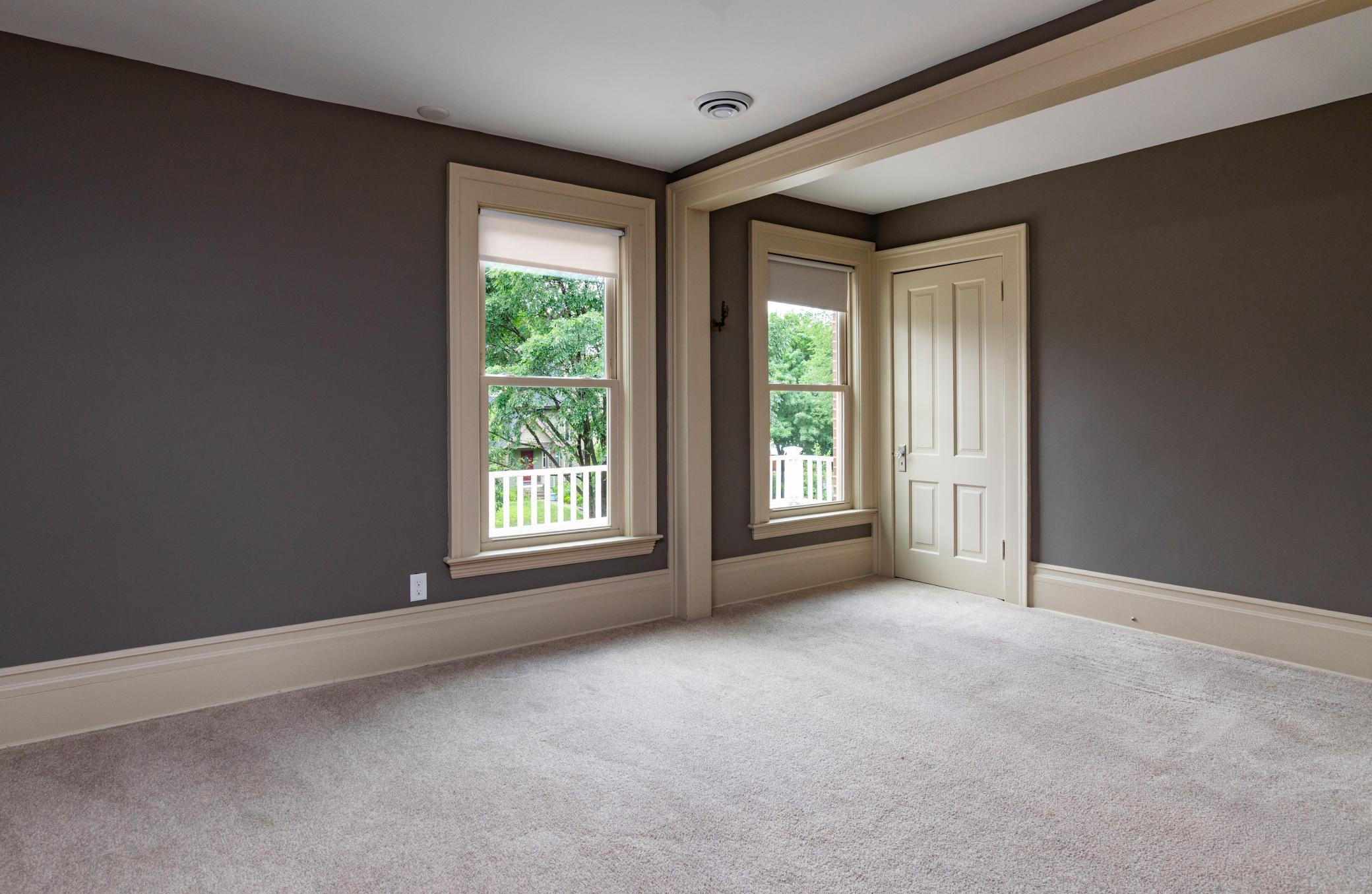 This large bedroom spans the entire front of the home, filling this room with natural light.