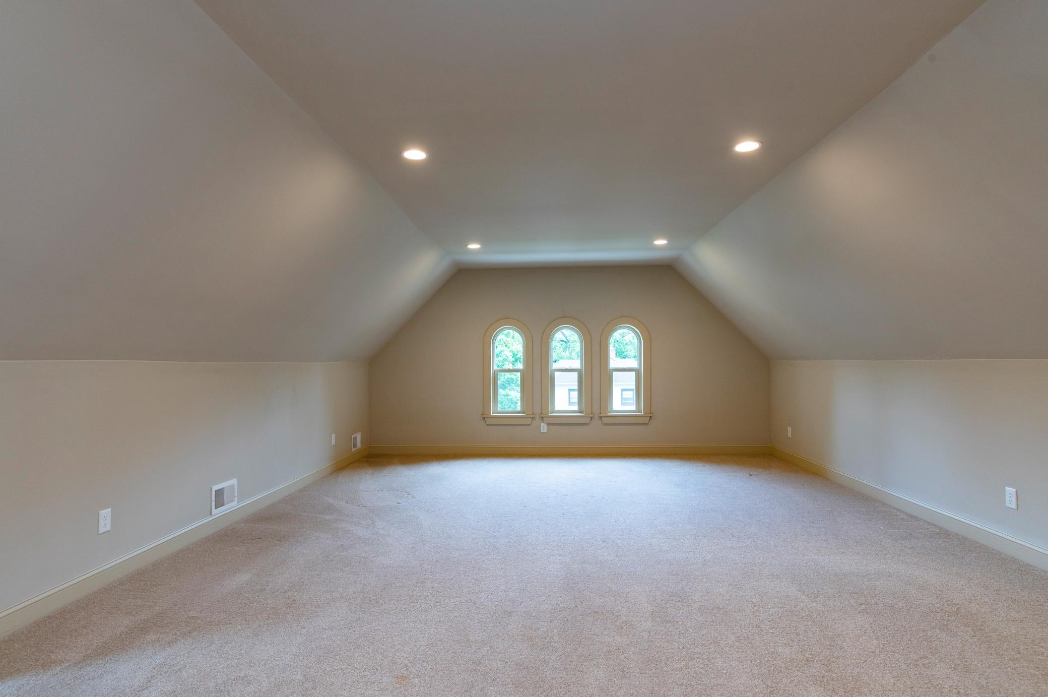 The huge top floor could be a large family room or second primary suite.