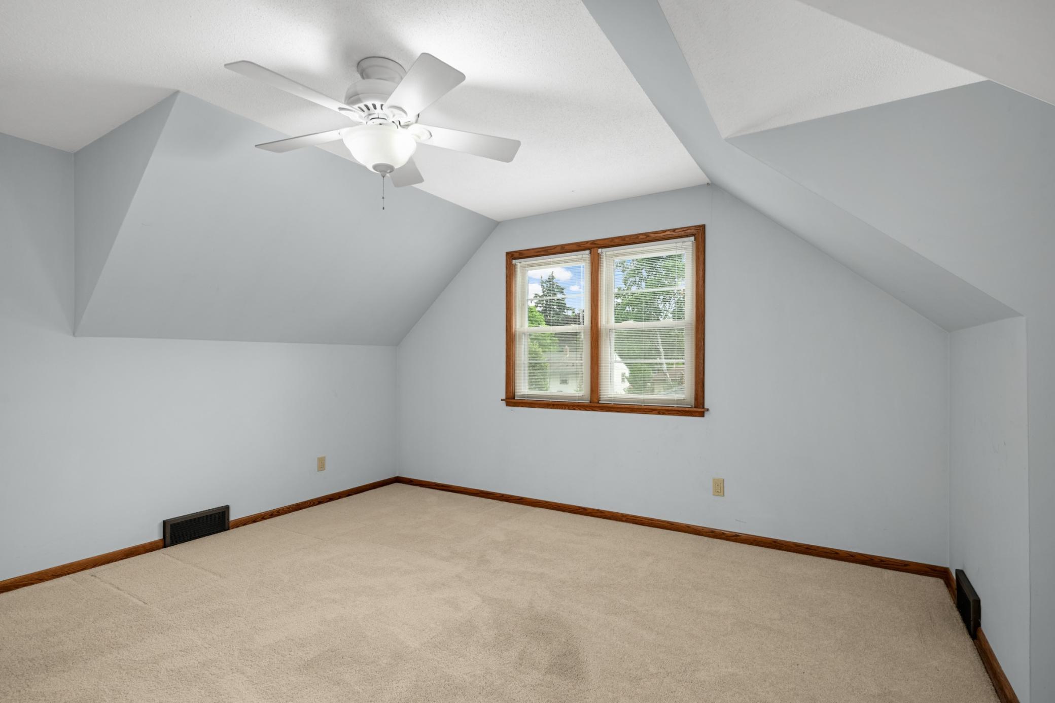 Large 3rd bedroom is upstairs and has a high ceiling.