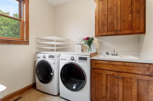 Bright laundry room with a large sink