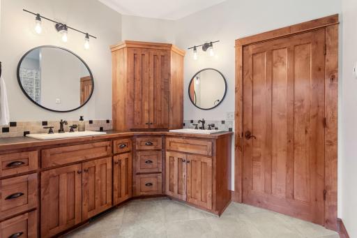 separate sinks, more storage and heated floors in the primary suite bathroom