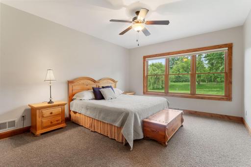 Bedroom 2 in the lower level with large windows and a walk-in closet