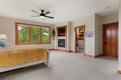 Main floor primary suite with a gas fireplace